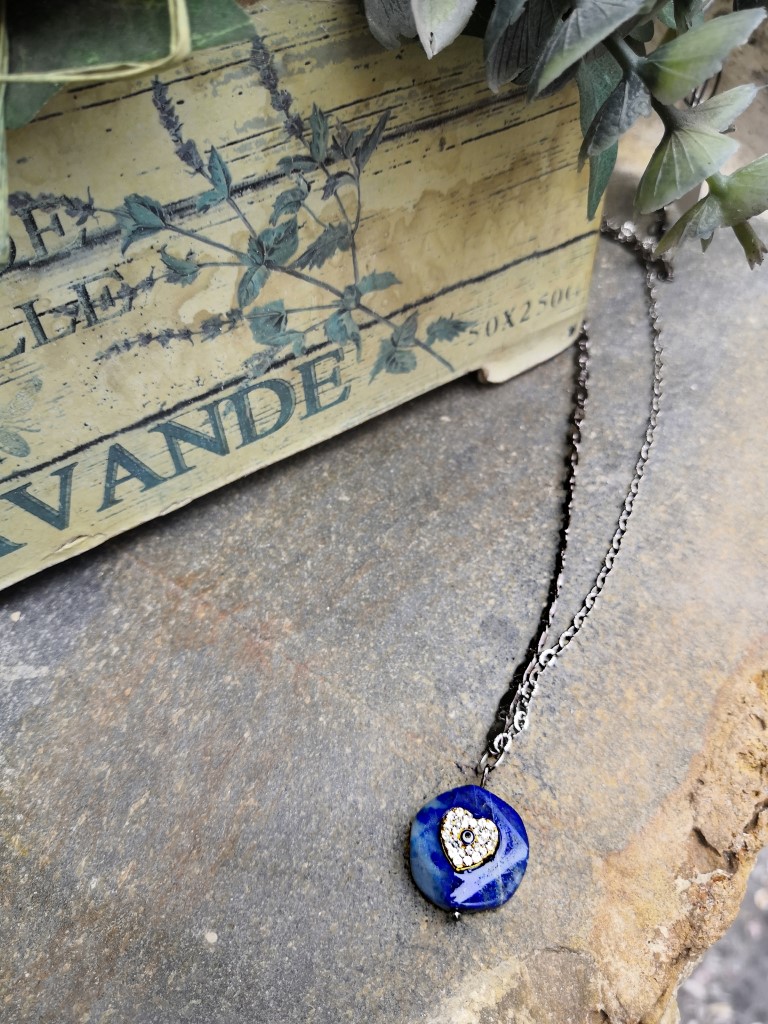 A handmade necklace made of copper chains in black color