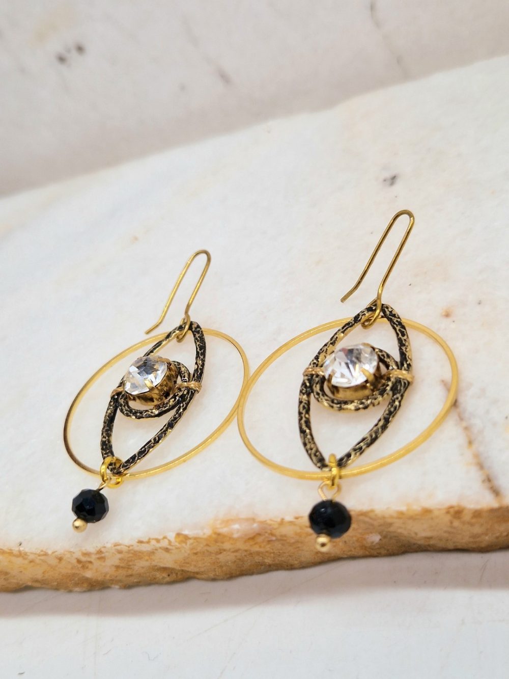 EARRINGS  WITH BRASS EYE INSIDE IN BRASS HOOP, CRYSTAL STONE AND BRASS HOOK