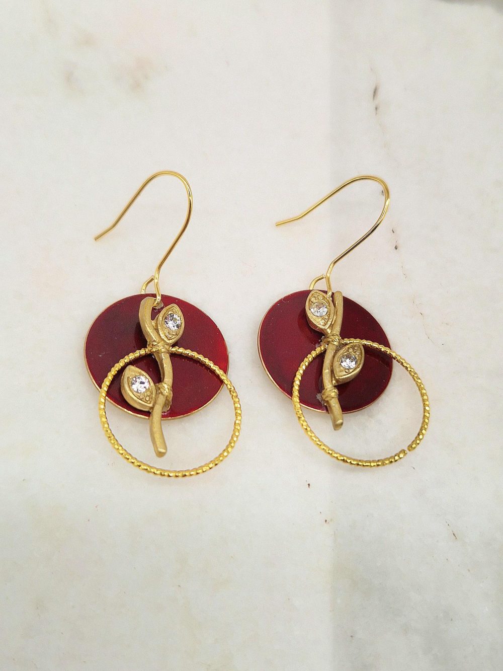 EARRINGS WITH BRASS DISC AND STRASS EYES