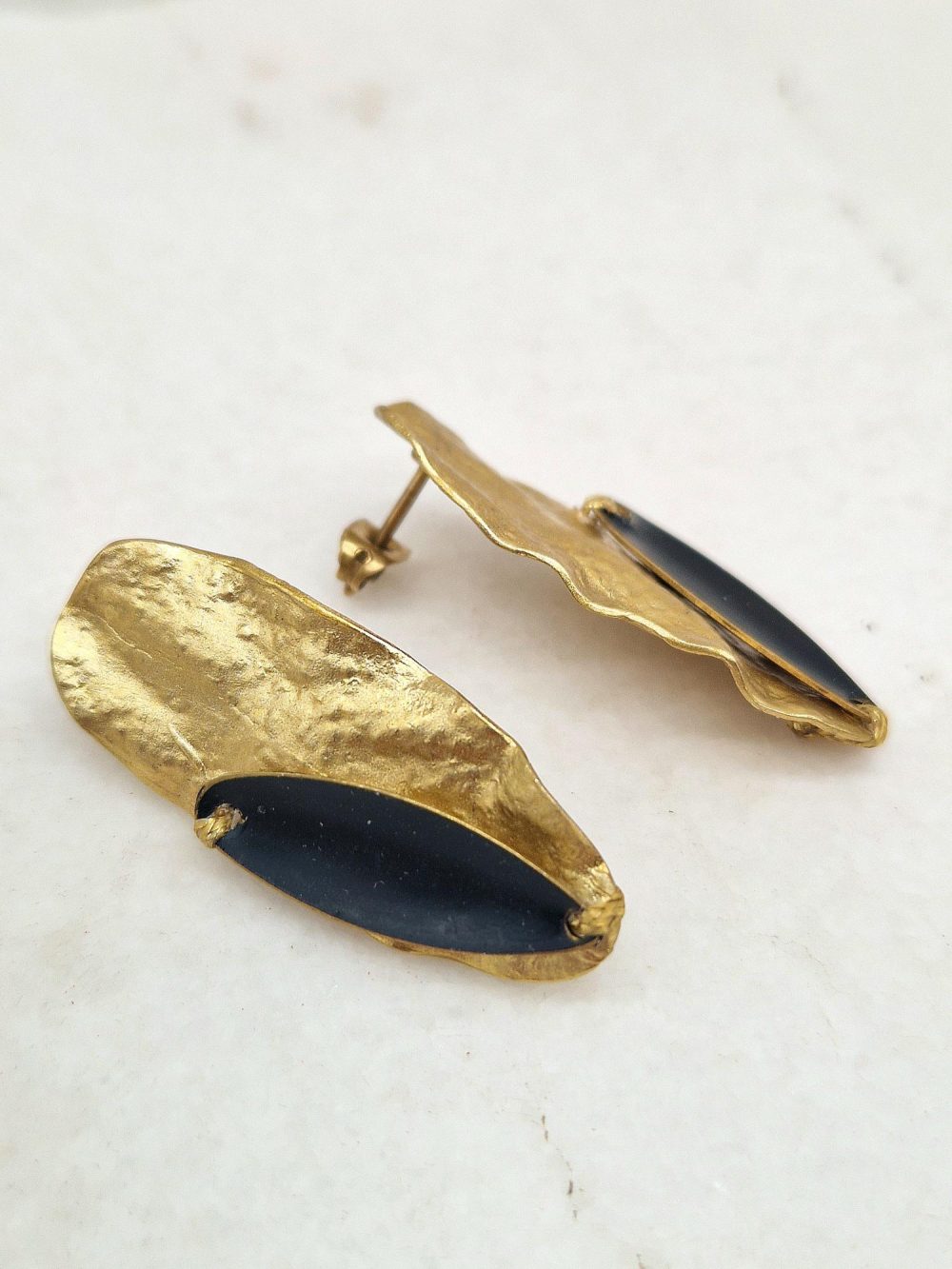 EARRINGS WITH  BRASS OVAL PATTERN AND BRASS OLIVE LEAF ON IT